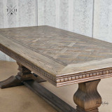 Detailed close-up of the intricate parquetry top on the Bedford Oak Dining Table, highlighting the exquisite craftsmanship