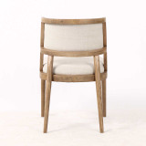 Rear view of the Argent Dining Chair with linen upholstered panel and natural wooden legs, perfect for modern and Hamptons-style dining rooms.