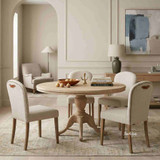 The Stratford Dining Chair in a setting, showcasing its tailored textured weave back, brass stud trim and signature top grain leather pull handle, ideal for modern Hamptons dining interiors.