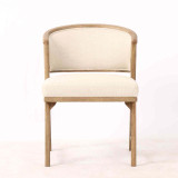 Front view of the Windsor Dining Chair displaying its sculpted timber frame, balanced proportions and textured neutral upholstery, ideal for luxury contemporary dining interiors