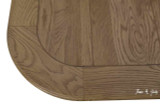 Detailed close-up of solid oak tabletop showing finely brushed wood grain, smooth finish, and premium craftsmanship.