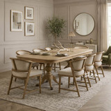 Styled image of the Berkshire Oak Double Extension Dining Table with Windsor Chairs.