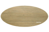A top view of the Ovalis Dining Table by Thomas & Hurley highlighting the elongated oval tabletop, natural timber grain, and contemporary design suited to modern luxury dining spaces.