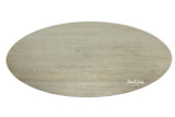 A top view of the Ovalis Dining Table by Thomas & Hurley highlighting the elongated oval tabletop, natural timber grain, and contemporary design suited to modern luxury dining spaces.