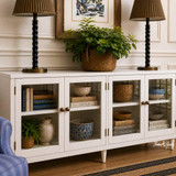 White timber media console with minimalist architectural form and storage