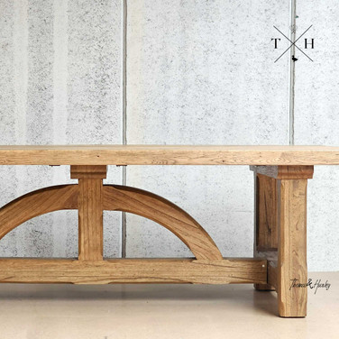 Zoomed-in view of the unique 'bridge-style' legs, a hallmark of the Trailbridge Canyon Table’s design Zoomed-in view of the unique 'bridge-style' legs, a hallmark of the Trailbridge Canyon Table’s design