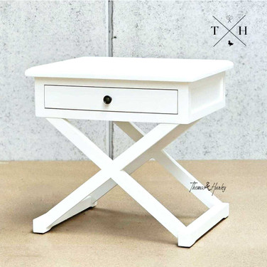 Side view of the bedside table, emphasizing its linear profile and x-base cross-leg detailing.