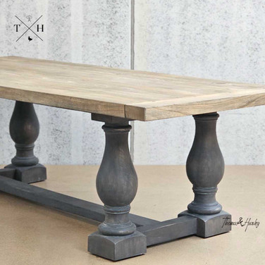 Angled view of the Parkhouse Double Pedestal Dining Table emphasising the elegant pedestal design.