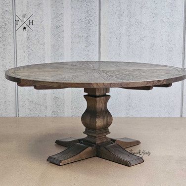 Full side view displaying the round shape and classic design of the Darcy Oak Parquetry Dining Table.