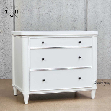 Angled view of Brynmore 3 Drawer Bedside showcasing the three spacious drawers and an elegant silhouette and curved front