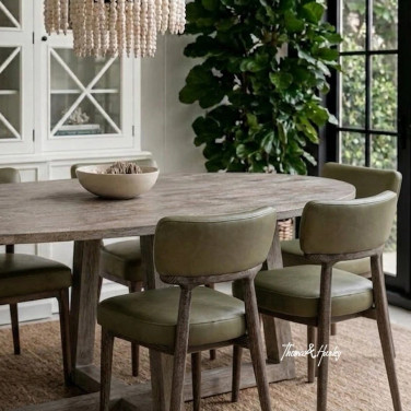 Royston Dining Chair in green leather and blackwash styled close-up showing upholstered seat and timber detail