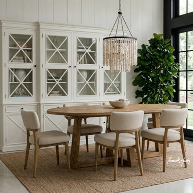 Ovalis 280cm natural oak dining table angled styled view in a luxury contemporary interior