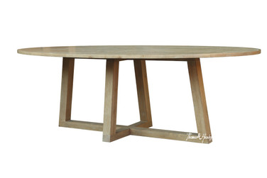 The Ovalis Dining Table by Thomas & Hurley, a contemporary oval timber dining table with sculptural angled trestle base, photographed from the front angle highlighting the modern luxury design and natural wood grain.