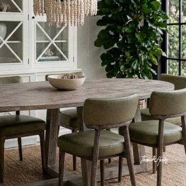 Ovalis 220cm brushed oak oval dining table styled angled view in a contemporary interior