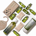 Recyclable hotel toiletry kit with travel-size bottles and bar soap