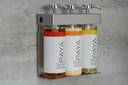 SOLera Paya 3-chamber dispenser mounted in hotel shower