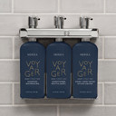 Inside Mersea Voyager dispenser with three 8.5 oz refillable bottles and pumps
