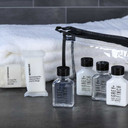 Grey + Finch guest amenity kit with shampoo, conditioner, lotion, body wash, and two soap bars