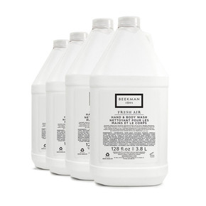 Bulk 4 gal recyclable HDPE conditioner jugs stacked for hotel use
