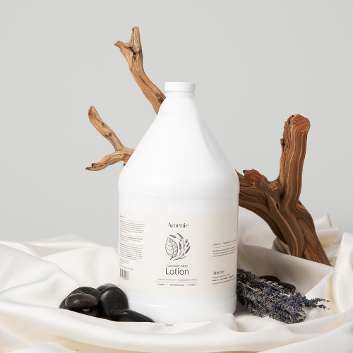 Amenie Salon lavender lotion gallon bottle with spa stones and wood decor