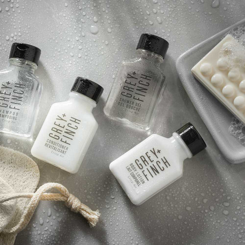 Grey + Finch citrus-scented toiletries in sleek 0.84 oz bottles for hotel guest bathrooms