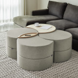 This image depicts a modern living room with a modular ottoman storage system serving as the focal point. The ottoman features clean lines and a sleek design, perfectly complementing the room’s modern aesthetic. Its modular design allows for flexible configuration, making it adaptable to various needs and spaces. The ottoman's storage capabilities are highlighted through its open compartments and lift-top lid, showcasing its functionality as a practical piece of furniture. The image effectively conveys the storage ottoman's versatility, suitability for various rooms like bedrooms, living rooms, and even office spaces, and its ability to enhance the modern feel of any environment.