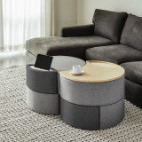 This image depicts a modern living room with a modular ottoman storage system serving as the focal point. The ottoman features clean lines and a sleek design, perfectly complementing the room’s modern aesthetic. Its modular design allows for flexible configuration, making it adaptable to various needs and spaces. The ottoman's storage capabilities are highlighted through its open compartments and lift-top lid, showcasing its functionality as a practical piece of furniture. The image effectively conveys the storage ottoman's versatility, suitability for various rooms like bedrooms, living rooms, and even office spaces, and its ability to enhance the modern feel of any environment.