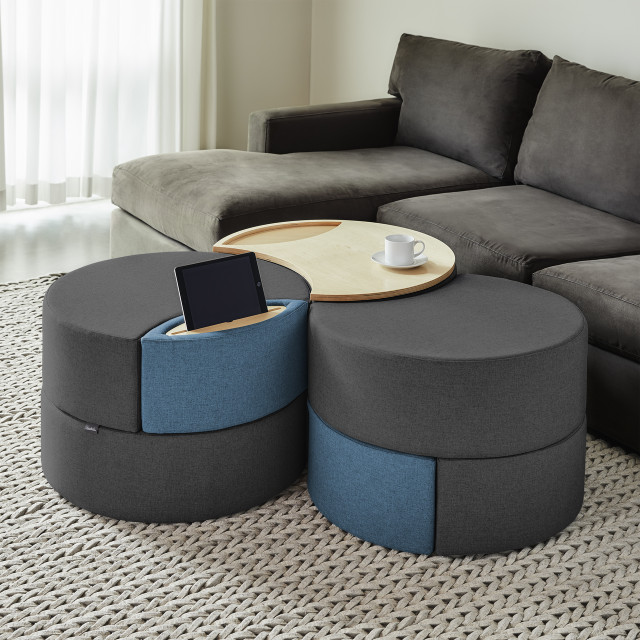 This image depicts a modern living room with a modular ottoman storage system serving as the focal point. The ottoman features clean lines and a sleek design, perfectly complementing the room’s modern aesthetic. Its modular design allows for flexible configuration, making it adaptable to various needs and spaces. The ottoman's storage capabilities are highlighted through its open compartments and lift-top lid, showcasing its functionality as a practical piece of furniture. The image effectively conveys the storage ottoman's versatility, suitability for various rooms like bedrooms, living rooms, and even office spaces, and its ability to enhance the modern feel of any environment.