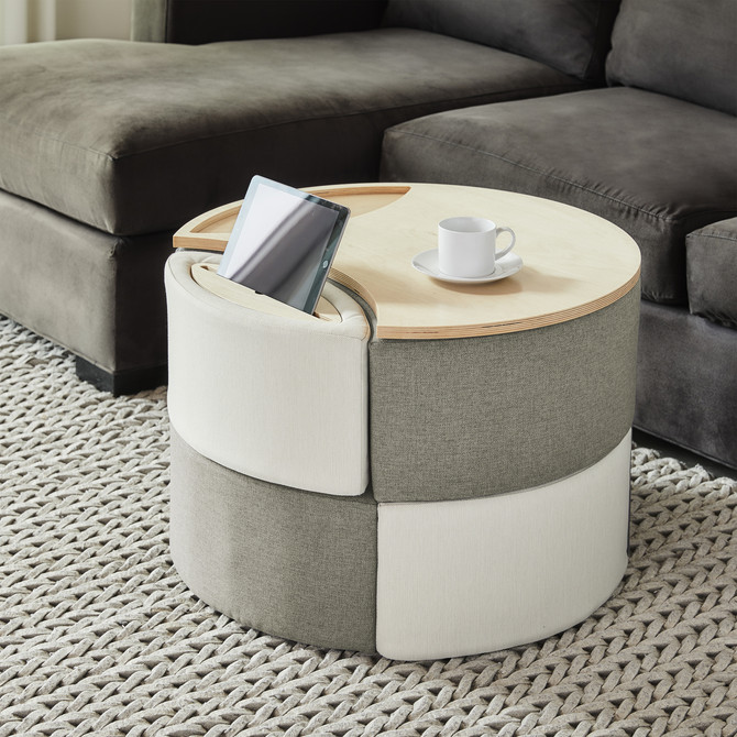 This image depicts a modern living room with a modular ottoman storage system serving as the focal point. The ottoman features clean lines and a sleek design, perfectly complementing the room’s modern aesthetic. Its modular design allows for flexible configuration, making it adaptable to various needs and spaces. The ottoman's storage capabilities are highlighted through its open compartments and lift-top lid, showcasing its functionality as a practical piece of furniture. The image effectively conveys the storage ottoman's versatility, suitability for various rooms like bedrooms, living rooms, and even office spaces, and its ability to enhance the modern feel of any environment.