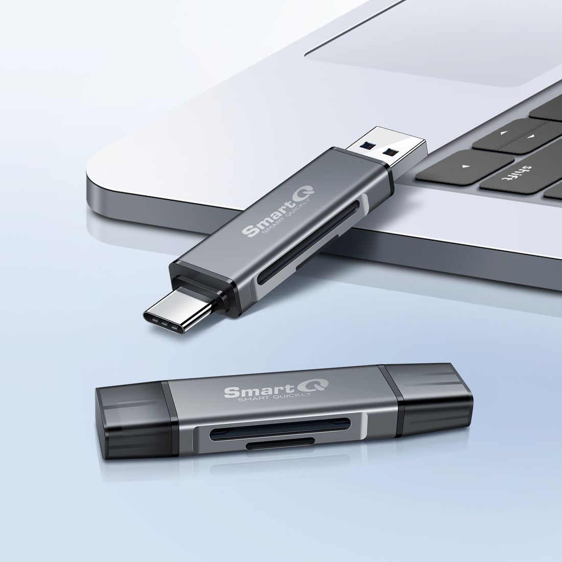 SmartQ USB-C and USB-A card reader next to a laptop