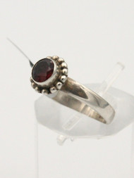 <p>Garnet faceted stone ring in 925 sterling silver. Size 9.0</p>
