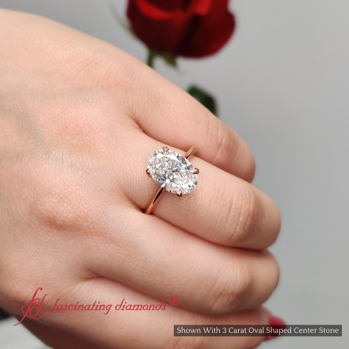 solitaire knife edge oval shaped diamond engagement ring in rose gold FD9239OVRHAND NL FI RG
