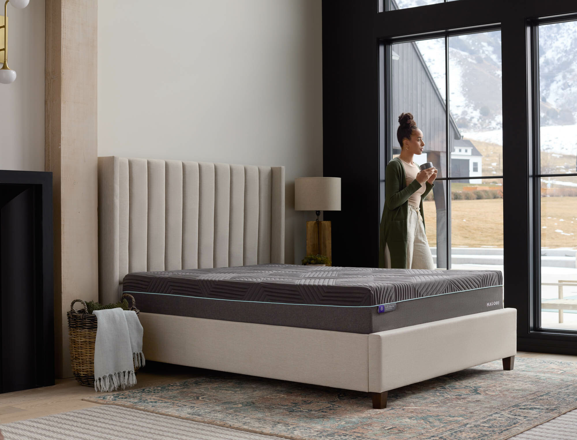 Image of mattress and person looking out window