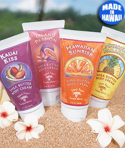 Island Soap Company Shea Butter Body Creams on display at the beach circled with white flowers