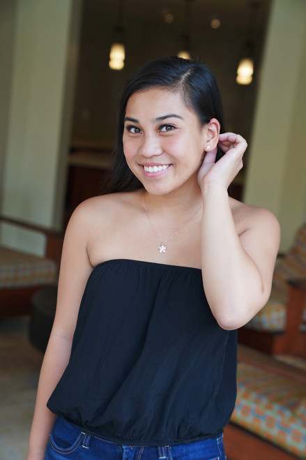 Sterling Silver 18" Necklace Solid Plumeria Pendant being worn by a beautiful model who is also showcasing the Sterling Silver Plumeria Stud Earring