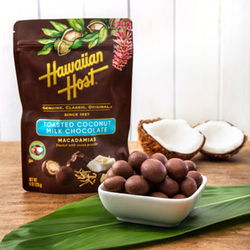 Hawaiian Host Paradise Collection - Toasted Coconut Milk Chocolate Covered Macadamias: the actual chocolates in a bowl in front of the pouch