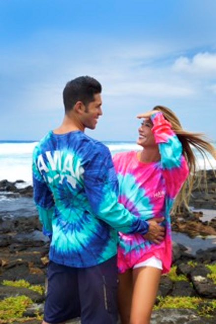 Couple wearing Hawaii Tie Dye UNISEX Long Sleeve Jersey Tee. Male in teal/navy color and female in pink/navy color