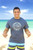 Male model wearing Hawaiian Performance Surfwear® - Honu Tapa **Please note: The model image may not be the design you are currently viewing. This is meant to show the style and fit of the shirt.