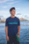 Male model standing wearing Hawaiian Athletics® - Islands Pocket **Please note: The model image may not be the design you are currently viewing. This is meant to show the style and fit of the shirt.