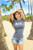 Female model wearing Island Girl® Surf Tee - Island Girl Hangloose in Charcoal Heather Color **Please note: The model image may not be the design you are currently viewing. This is meant to show the style and fit of the shirt.