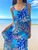 Model wearing Napua Collection Ruffle Maxi Dress - Abstract Monstera: Blue (Front)