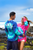 Couple wearing Hawaii Tie Dye UNISEX Long Sleeve Jersey Tee. Male in teal/navy color and female in pink/navy color