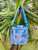 Paradise Chill Cooler - Floral Garden Light Blue on palm tree in Ala Moana Beach Park
