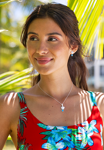 Female model wearing 18' Sterling Silver Plumeria Pendant Necklace