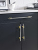 Amerock, Urbanite, 10 1/16" (256mm) Bar Pull, Brushed Gold with Black Chrome - installed 1