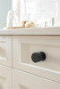 Amerock, Ballard, 1 1/8" Round Knob, Matte Black - installed 1 Amerock, Ballard, 1 1/8" Round Knob, Matte Black - installed 1
