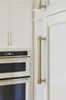 Amerock, Farewind, 7 9/16" (192mm) Straight Pull, Golden Champagne - installed 1 Amerock, Farewind, 7 9/16" (192mm) Straight Pull, Golden Champagne - installed 1
