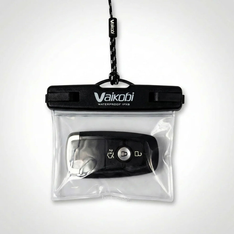 Compact waterproof pouch storing a single car key and credit card