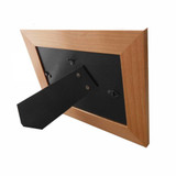 Back of wood picture frame showing easel and attached wall mount hooks