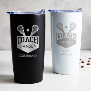 Custom engraved black and white stainless steel tumblers with lacrosse design, coach's name, and other text.